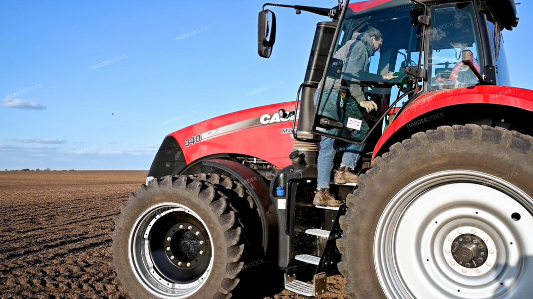 Farmer Climbing into Cab 25225