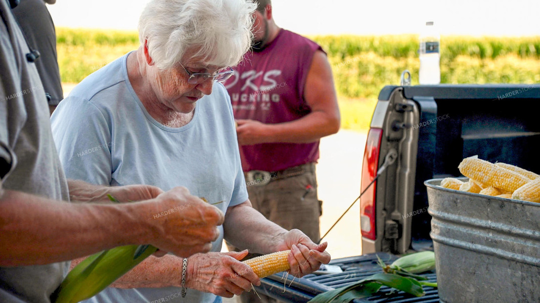 Family Shucking Sweet Corn 25251