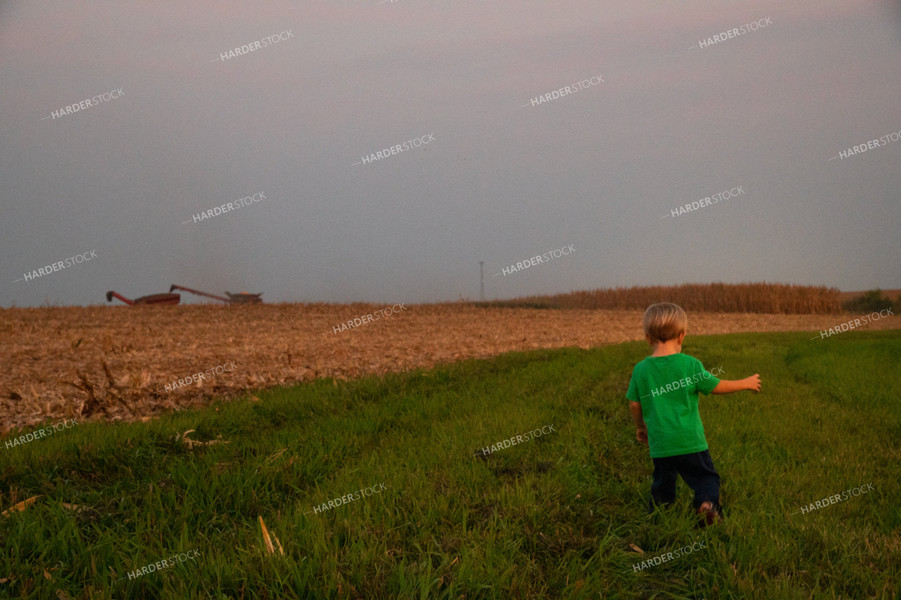 Farm Kid Waiting to Ride in the Combine 25484