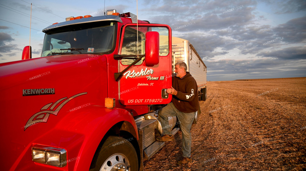 Farmer Climbing into Semi Cab 25733