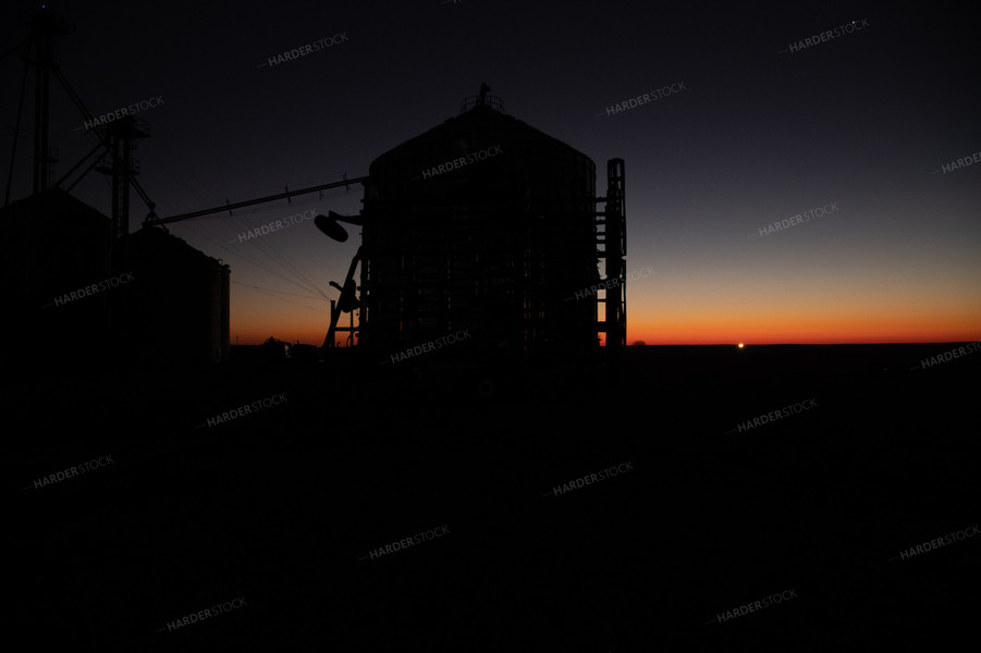 Grain Bin Silhouette at Sunrise 25851