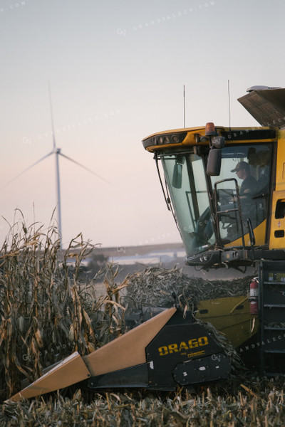 Combine Harvesting Corn at Sunset 70050