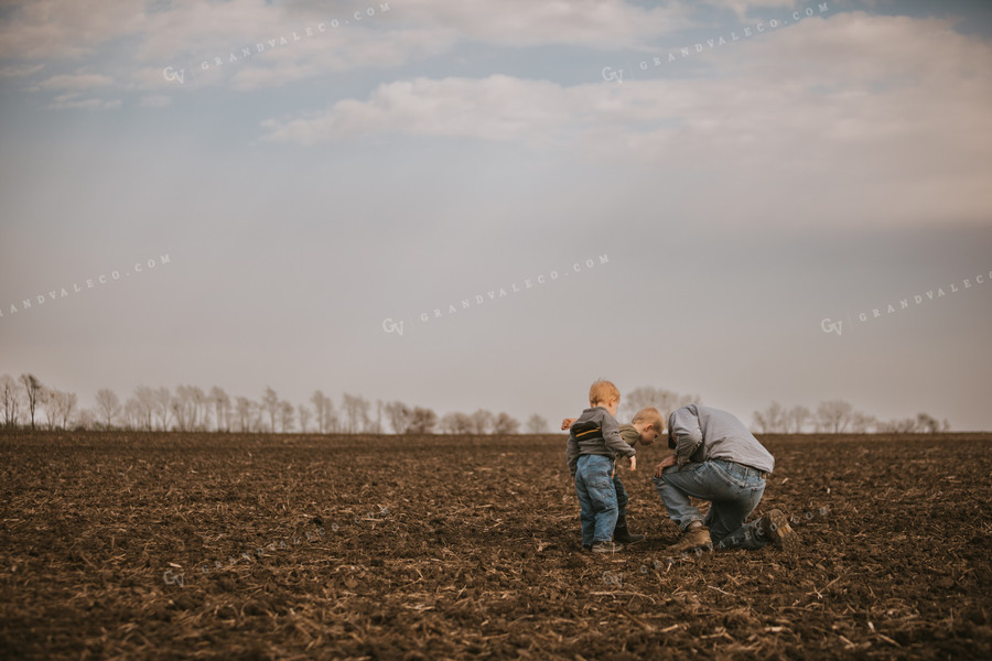 Farmer Checking Seed Depth with Farm Kids 5484