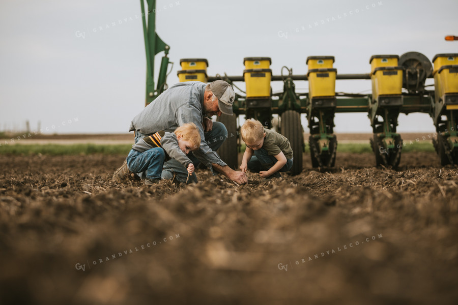 Farmer Checking Seed Depth with Farm Kids 5488