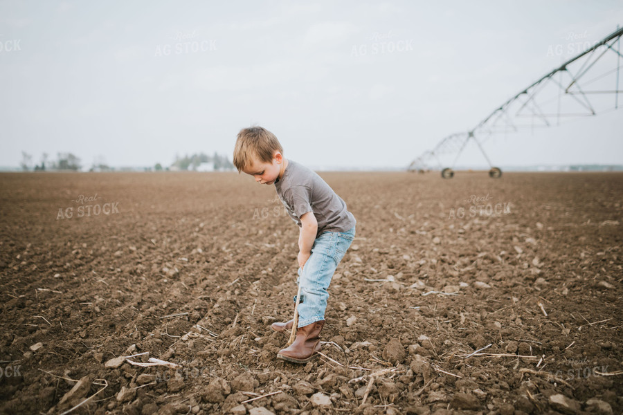 Farm Kid Digging in Soil 5604