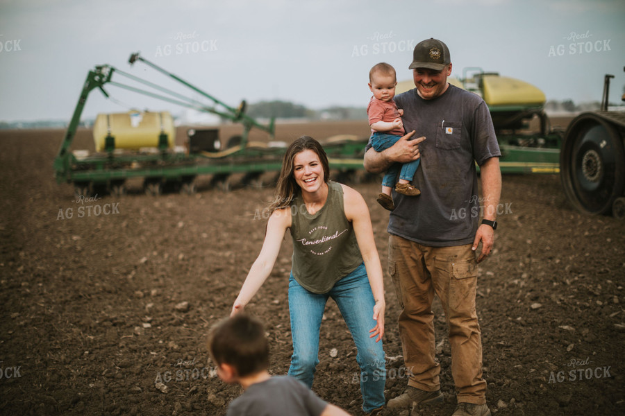 Farm Family in Field During Planting 5647