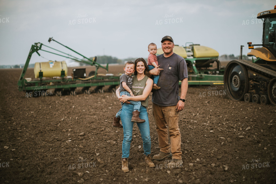 Farm Family in Field During Planting 5648