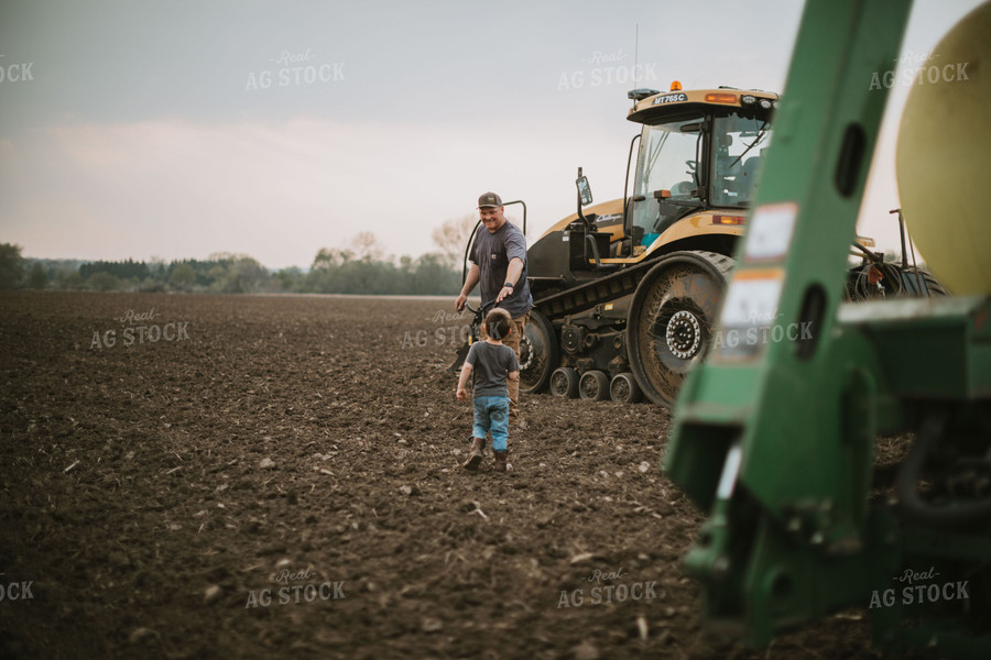 Farmer Walking Toward Planter Tractor with Farm Kid 5664