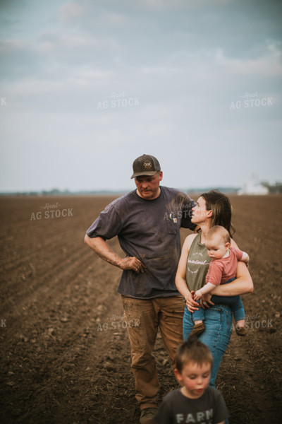Farm Family in Field During Planting 5694