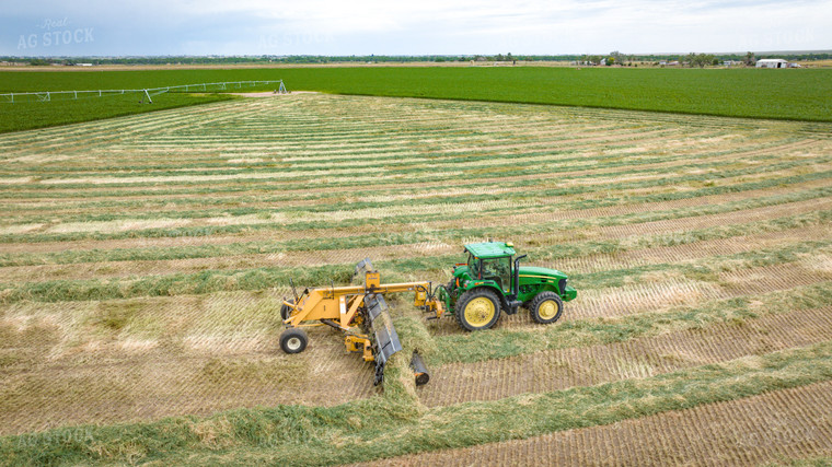 Tractor with Merger in Hay Field 56414