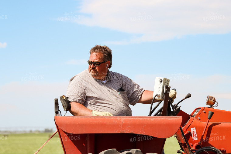 Male Farmer on Tractor 83041