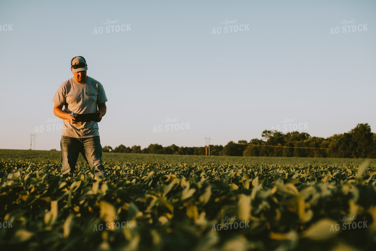 Farmer in Soybean Field with Tablet 6140