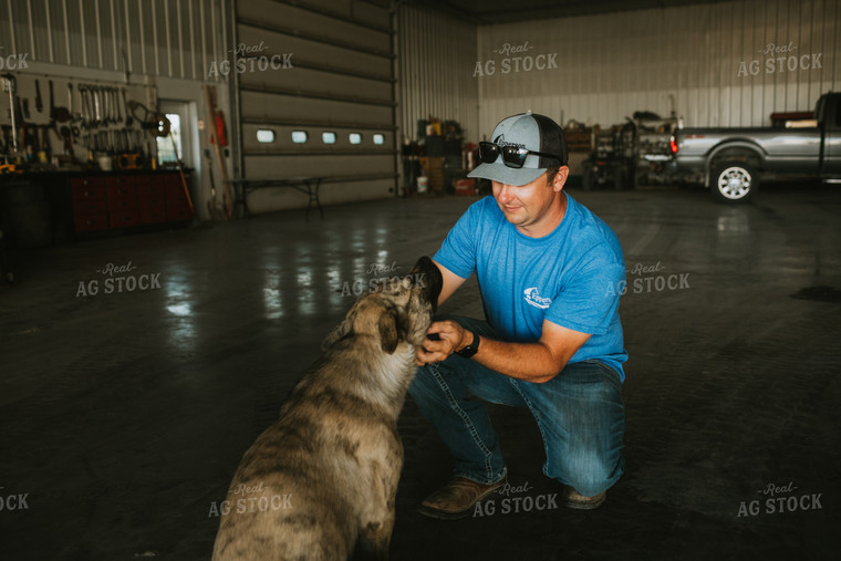 Farmer Petting Dog in Farm Shop 6202