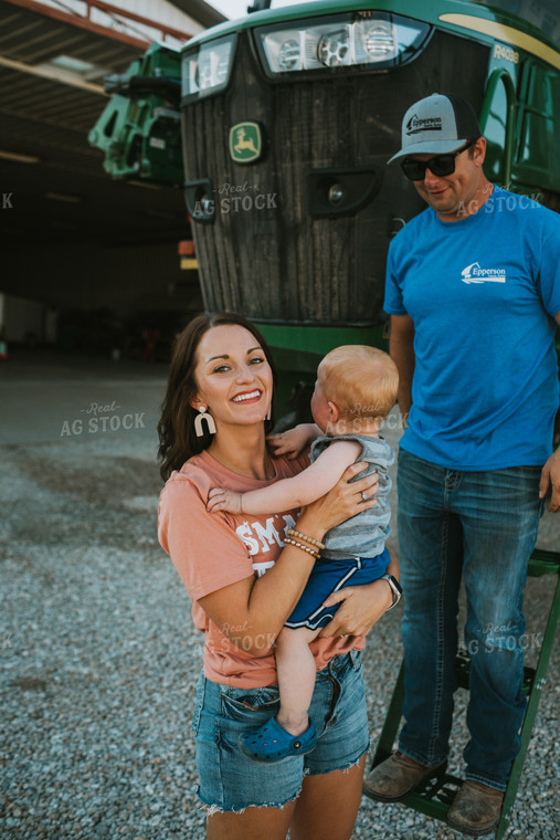 Farm Mom Helping Kids Down from Sprayer 6234