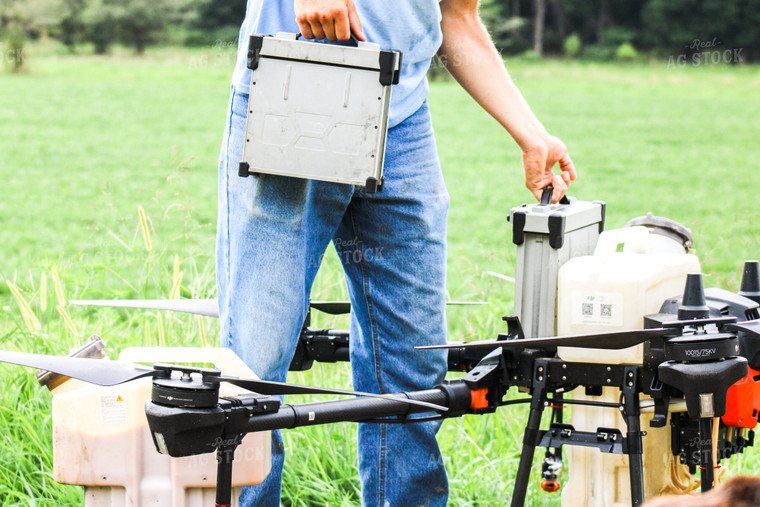 Farmer Refilling Drone 101020