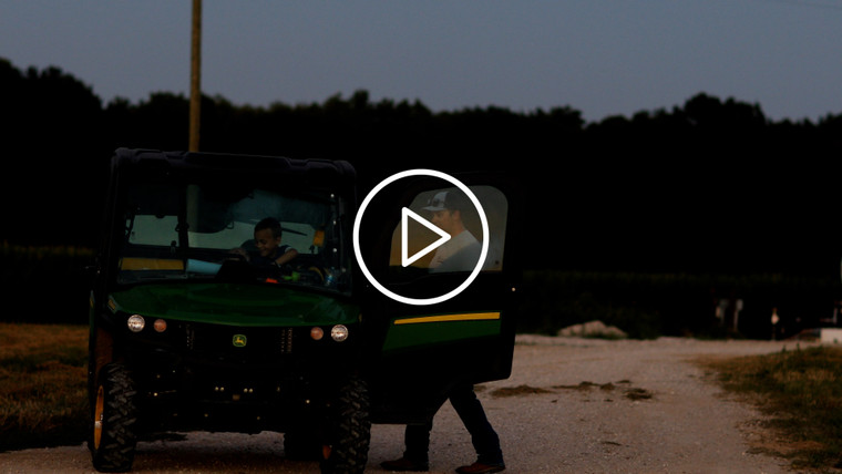 Farmer Climbing into Gator at Dusk 6500