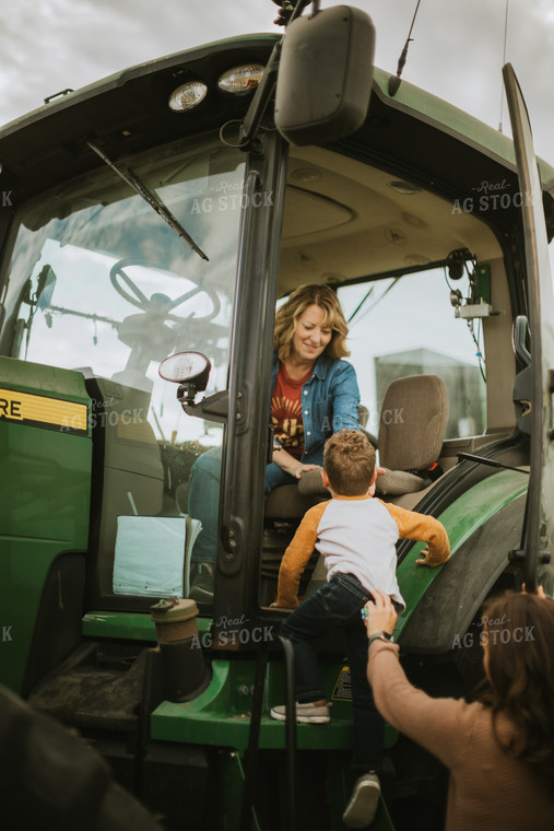 Farm Kid Getting in Tractor 6604