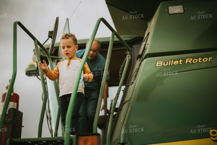 Farm Kid Getting out of Combine 6613