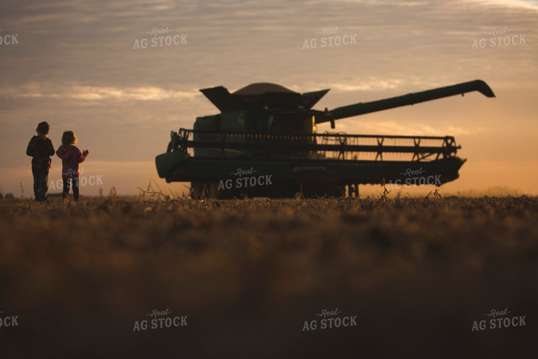 Farm Kids Watching Combine Silhouette