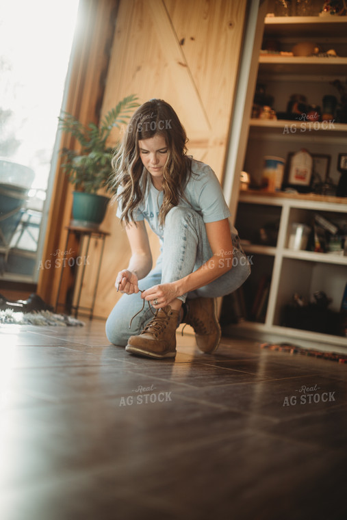 Farmer Putting on Shoes 6814