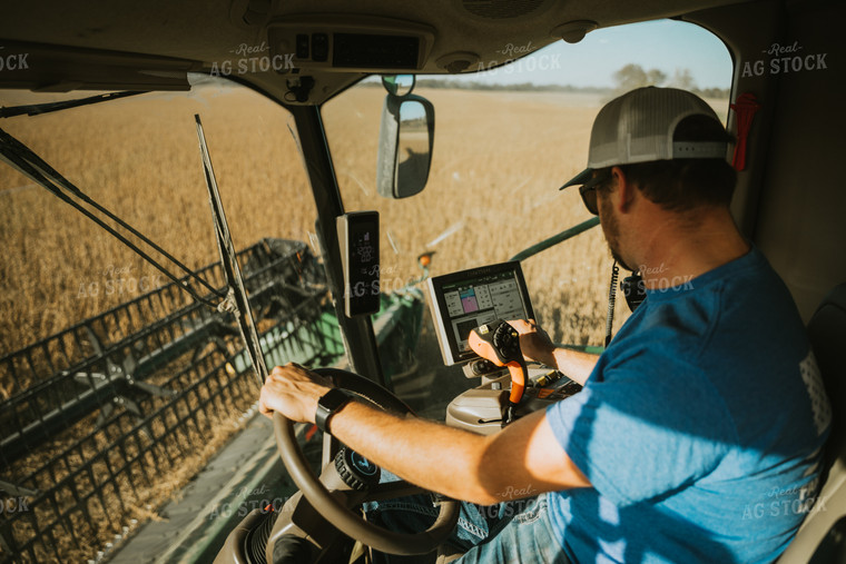 Farmer Operating Combine 7108