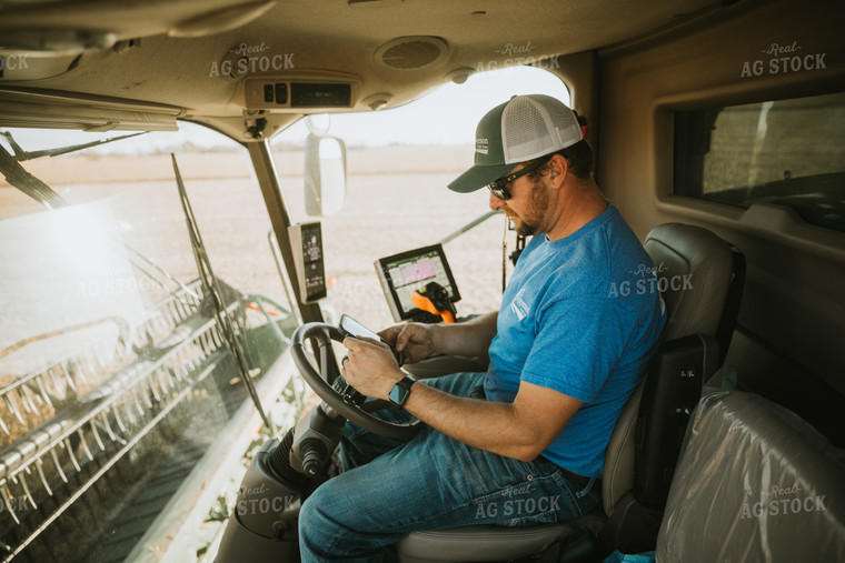 Farmer Inside of Combine on Phone 7206