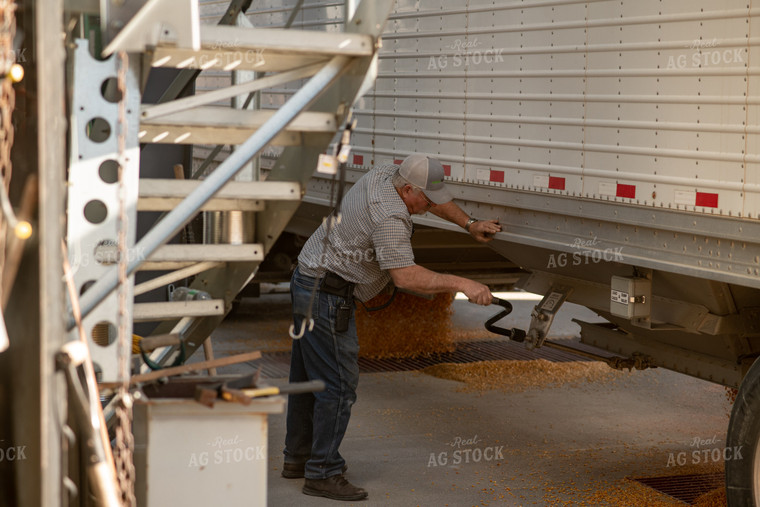Farmer Unloading Semi Truck 76318