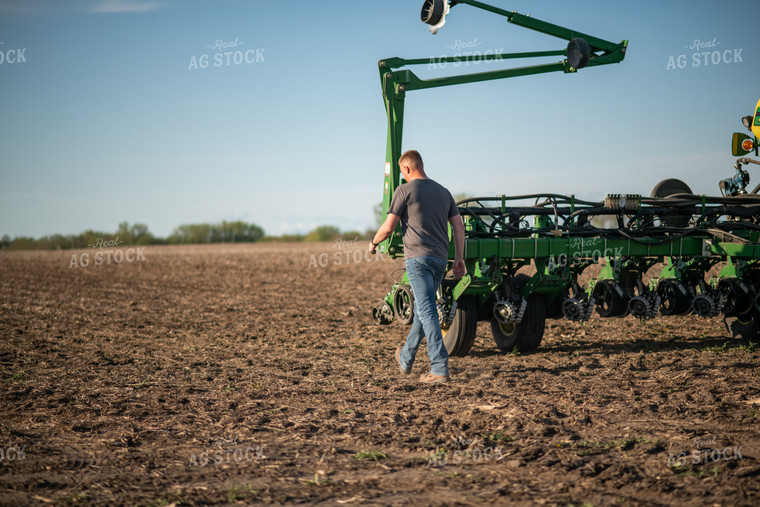 Farmer Walking Towards Planter 76375