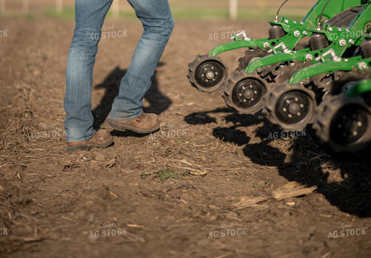 Farmer Walking Away from Planter 76377