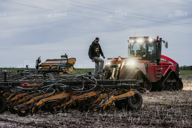 Farmer Looking at Air Seeder 64264