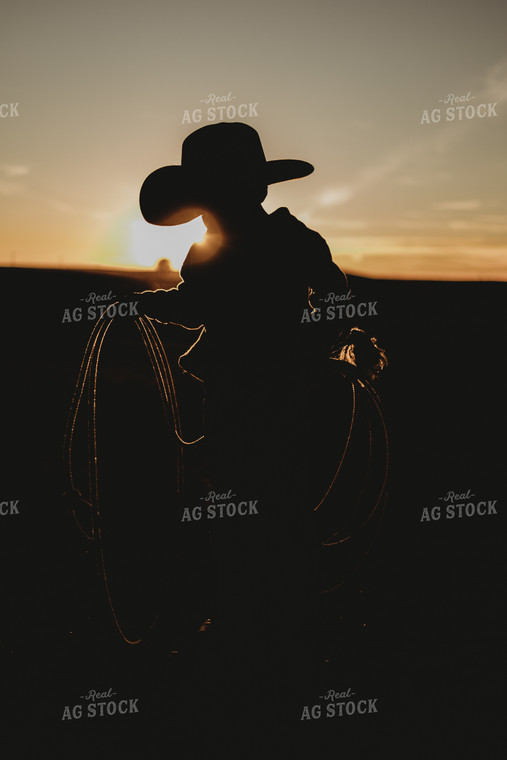 Silhouette of Farm Kid Holding Rope 61127