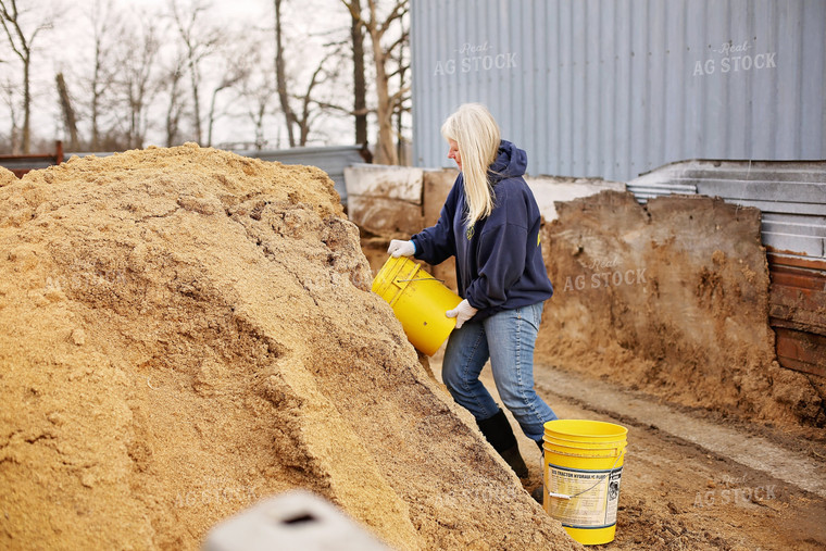 Female Farmer Working in Farmyard 127009