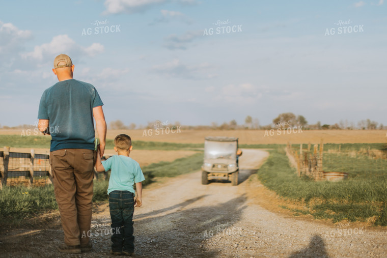 Farmer and Farm Kid Walking Down Road 7410