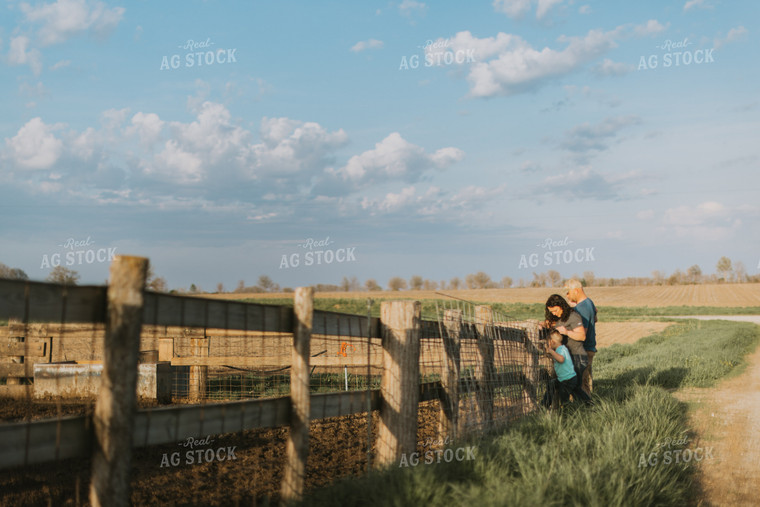 Farm Family Standing at Fence 7412