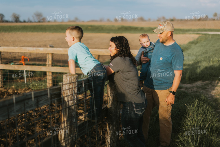 Farm Family Standing at Fence 7414
