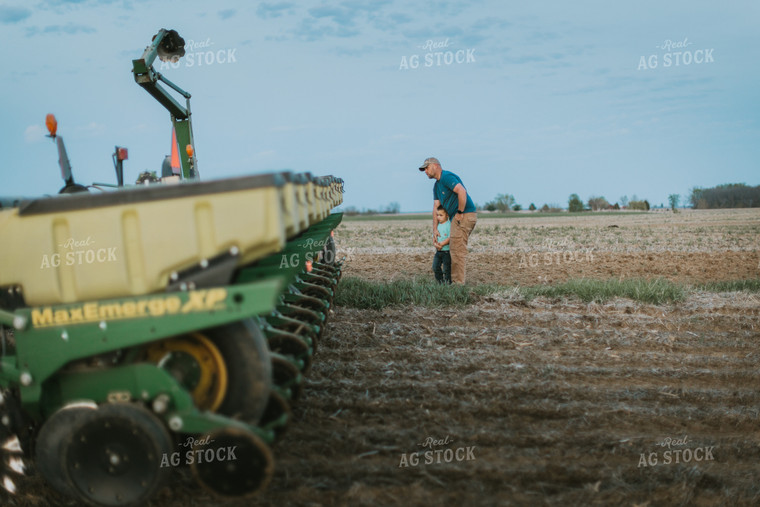 Farmer in Field with Farm Boy 7472