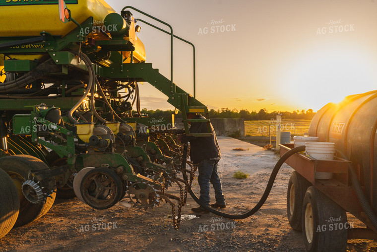 Farmer Working on Planter 128022