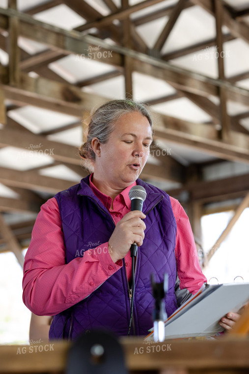 Woman Speaking into Microphone 52612