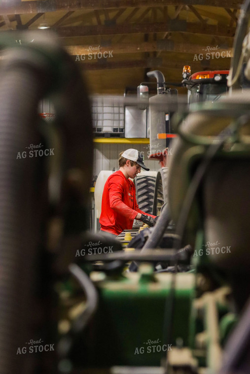 Farmer Working in Shed 109082