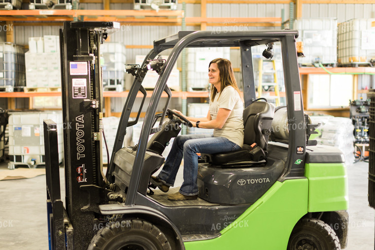 Woman Farmer Drives Skid Steer 7487