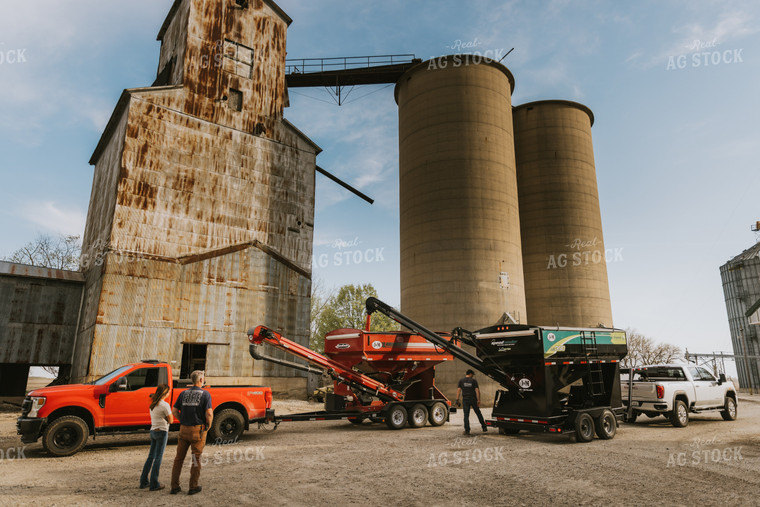 Farmers Look on as Treated Soybean Seed Dumps into Tender 7603