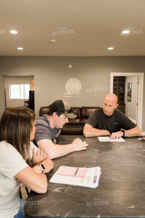 Farmers Review Seed Orders in Farm Office 7619