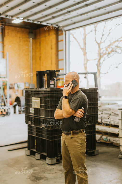 Farmers Talks on Phone in Seed Shed 7631