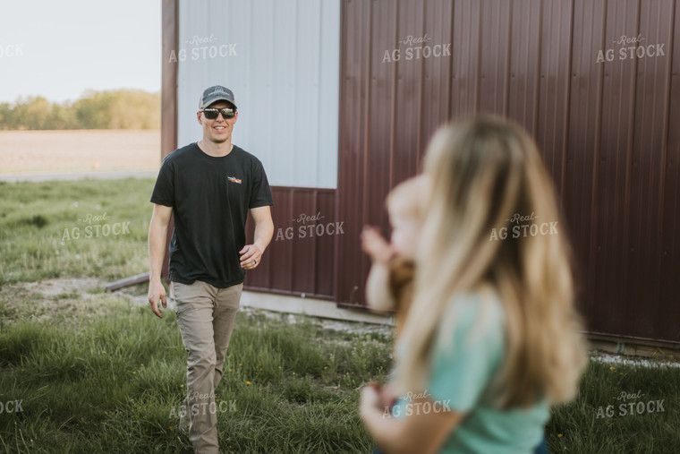 Young Farmer Greeting Family 7644