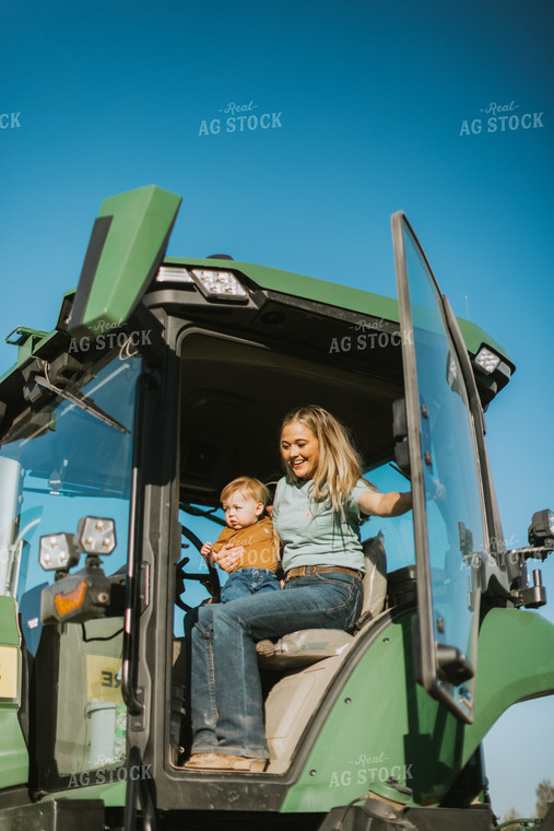 Farm Wife Closes Tractor Door While Holding Child 7648