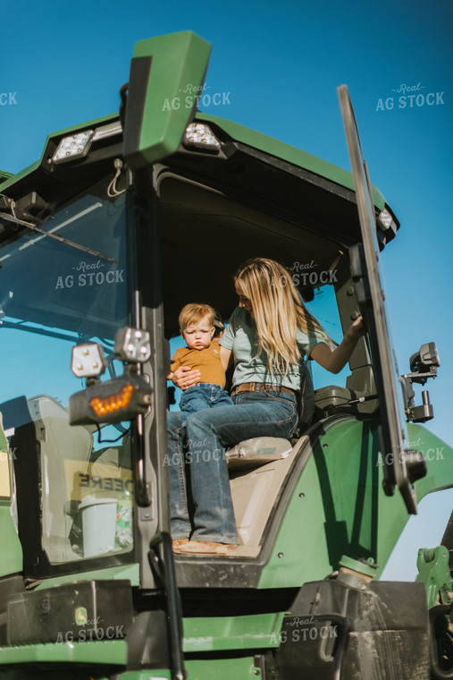 Farm Wife Closes Tractor Door While Holding Child 7649
