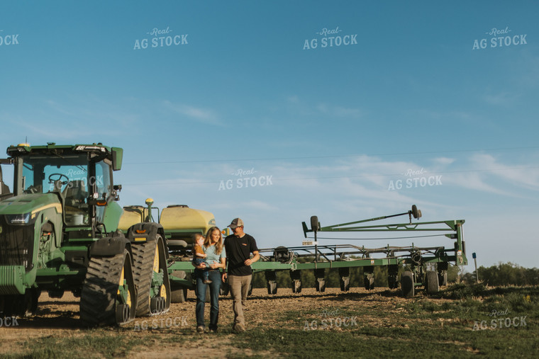Young Couple with Child Walk Away from Tractor 7650