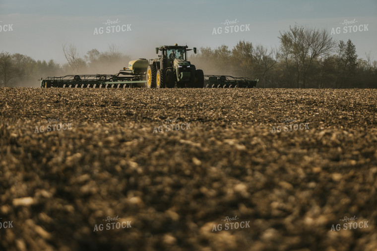 Tractor Planting Field While Child Sits on Farmer's Lap 7659