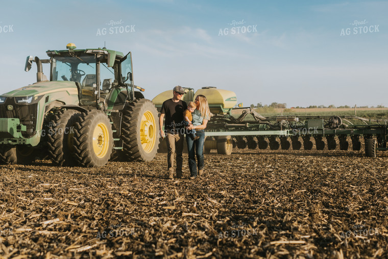 Young Couple with Child Walk Away from Tractor 7661