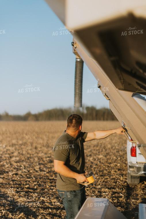 Farmer Prepares Seed Tender in Field 7694